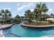Inviting lazy river pool surrounded by lush landscaping and palm trees at 768 Satterwhite Way, Myrtle Beach, SC 29577