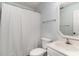 Well-lit bathroom featuring a vanity with a mirror, a toilet, and a shower curtain at 813 Starboard Ct., Murrells Inlet, SC 29576