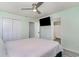 Bedroom featuring a large bed, closet, and bathroom access at 813 Starboard Ct., Murrells Inlet, SC 29576