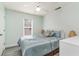 Bright bedroom with a comfortable bed, ceiling fan, and natural light at 813 Starboard Ct., Murrells Inlet, SC 29576