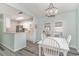 Bright dining area with a decorative chandelier and patio doors at 813 Starboard Ct., Murrells Inlet, SC 29576