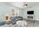 Cozy living room with fireplace, comfortable seating, and ample natural light at 813 Starboard Ct., Murrells Inlet, SC 29576