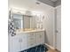 Bathroom featuring double sink vanity with white cabinets, large mirror, and accent rug at 8560 Queensway Blvd. # 1206, Myrtle Beach, SC 29572