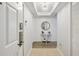 Stylish condo entryway features wood-look flooring, shiplap wall, and coastal-themed decor at 8560 Queensway Blvd. # 1206, Myrtle Beach, SC 29572
