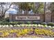 Kingston Plantation sign surrounded by colorful flowers and greenery at 8560 Queensway Blvd. # 1206, Myrtle Beach, SC 29572