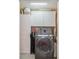 Well-equipped laundry room with modern washer, storage cabinets, and functional layout at 8560 Queensway Blvd. # 1206, Myrtle Beach, SC 29572