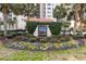 Attractive Brighton sign with lush landscaping and mature palm trees at 8560 Queensway Blvd. # 1206, Myrtle Beach, SC 29572