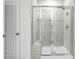 Modern tiled shower with glass enclosure and built-in seat in the bathroom at 8704 High Banks Way, Longs, SC 29568