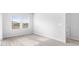 Sun-filled room featuring wood flooring and a large window overlooking the neighborhood at 8704 High Banks Way, Longs, SC 29568