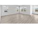 Bright living space with large windows and modern flooring creating a welcoming atmosphere at 8704 High Banks Way, Longs, SC 29568
