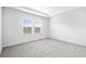 Bright bedroom with large window for natural light and neutral colored carpeting at 8720 High Banks Way, Longs, SC 29568
