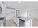 Bright kitchen features white cabinets, granite countertops, stainless appliances, and wood-look floors at 8720 High Banks Way, Longs, SC 29568