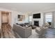 Inviting living room featuring a cozy fireplace, comfortable seating, and stylish decor at 8720 High Banks Way, Longs, SC 29568