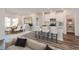 Open-concept living space featuring a dining area, kitchen with bar seating, and comfortable lounge area at 8720 High Banks Way, Longs, SC 29568