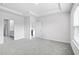 Spacious main bedroom featuring a tray ceiling and plush carpeting at 8720 High Banks Way, Longs, SC 29568