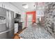Bright kitchen with granite countertops, stainless steel appliances, and a stylish tile backsplash at 939 Tiffany Ln., North Myrtle Beach, SC 29582