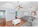 Living room with vaulted ceilings, fan, and a white coffee table at 939 Tiffany Ln., North Myrtle Beach, SC 29582