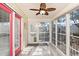 Bright sunroom featuring a ceiling fan, large windows, and access to the outdoors at 939 Tiffany Ln., North Myrtle Beach, SC 29582