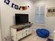 Nautical-themed bedroom with wooden floors, comfortable seating and large television at 971 Blue Stem Dr. # 41 H, Pawleys Island, SC 29585