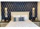 Nautical-themed bedroom with stylish wallpaper, decor, and bedding for a relaxing coastal retreat at 971 Blue Stem Dr. # 41 H, Pawleys Island, SC 29585