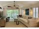 Bright living room with comfortable seating, ceiling fan, sliding door and outdoor view at 971 Blue Stem Dr. # 41 H, Pawleys Island, SC 29585