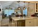 Open-concept living area with vaulted ceilings and seamless transition to the dining and kitchen areas at 971 Blue Stem Dr. # 41 H, Pawleys Island, SC 29585