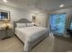 Cozy main bedroom with neutral tones, ceiling fan and balcony access to enjoy the outdoors at 971 Blue Stem Dr. # 41 H, Pawleys Island, SC 29585