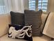 Coastal decor with assorted throw pillows on a comfortable couch near a window with natural light at 971 Blue Stem Dr. # 41 H, Pawleys Island, SC 29585