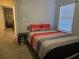 Bedroom featuring a bed, gray carpet, window, and black side table at 9903 Conifer Ln., Murrells Inlet, SC 29576