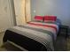 Features in bedroom include a queen bed, two closets, and a side table at 9903 Conifer Ln., Murrells Inlet, SC 29576