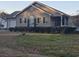 Beautiful single-story home featuring a well-kept lawn, inviting front porch, and attached garage at 9903 Conifer Ln., Murrells Inlet, SC 29576