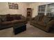 Inviting living room with neutral decor, comfortable sofas, and window at 9903 Conifer Ln., Murrells Inlet, SC 29576