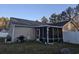 Relaxing screened-in porch perfect for outdoor living with comfortable seating and ample space at 9903 Conifer Ln., Murrells Inlet, SC 29576