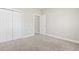 Empty bedroom with double closet doors and neutral carpeting at 10015 W Highway 19, Loris, SC 29569