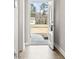 Hallway looking through open door, wood floors, and view to the outside at 10015 W Highway 19, Loris, SC 29569