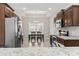 Eat-in kitchen features stainless steel appliances, wood cabinets and a view to the back yard at 10015 W Highway 19, Loris, SC 29569