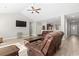 Spacious, open-concept living room with vaulted ceiling, wood floors, and a wall-mounted TV at 10015 W Highway 19, Loris, SC 29569