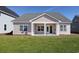 Home exterior shows a large backyard with a patio at 1071 Laconic Dr., Myrtle Beach, SC 29588