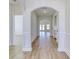 Bright hallway with archways, white trim, wood-look floors, and views to other rooms in the home at 1071 Laconic Dr., Myrtle Beach, SC 29588