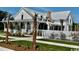 White, light-filled single-Gathering home with expansive porch and mature trees, perfect for relaxing at 1083 Milford Way, Myrtle Beach, SC 29588