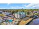Stunning aerial view of complex with pool and surrounding trees at 1100 Commons Blvd. # 1001, Myrtle Beach, SC 29572