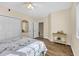 Charming bedroom with a ceiling fan, wood-look flooring, and a sunny window at 1100 Commons Blvd. # 1001, Myrtle Beach, SC 29572