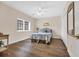 Cozy bedroom with a plush bed, wood-look flooring and natural light from large window at 1100 Commons Blvd. # 1001, Myrtle Beach, SC 29572