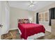 Bedroom featuring hard-surface floors and a plush bed in a neutral colored room at 1100 Commons Blvd. # 1001, Myrtle Beach, SC 29572