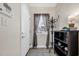 Inviting foyer with tile flooring, coat rack, and decorative shelving at 1100 Commons Blvd. # 1001, Myrtle Beach, SC 29572