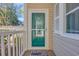 Condo front door with glass storm door, welcome mat, and building number 1001 at 1100 Commons Blvd. # 1001, Myrtle Beach, SC 29572