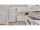 Efficient kitchen featuring a white refrigerator, stove, microwave, and tile flooring at 1100 Commons Blvd. # 1001, Myrtle Beach, SC 29572