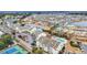 Aerial view of neighborhood featuring tennis courts, community pool, and lake at 1100 Possum Trot Rd. # C202, North Myrtle Beach, SC 29582