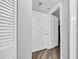 Bright condo entryway featuring wood-look floors, white walls, and closet space at 1100 Possum Trot Rd. # C202, North Myrtle Beach, SC 29582