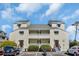 Charming two-story condo with private balconies and ample parking at 1100 Possum Trot Rd. # C202, North Myrtle Beach, SC 29582